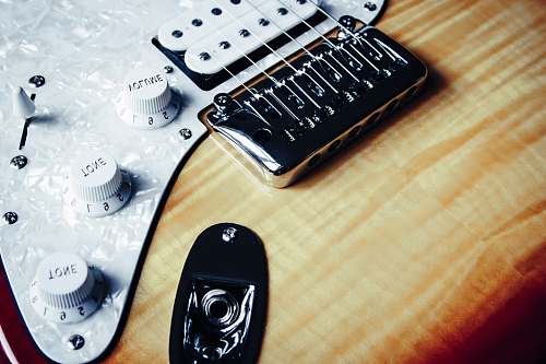 musical instrument gray and beige electric guitar leisure activities
